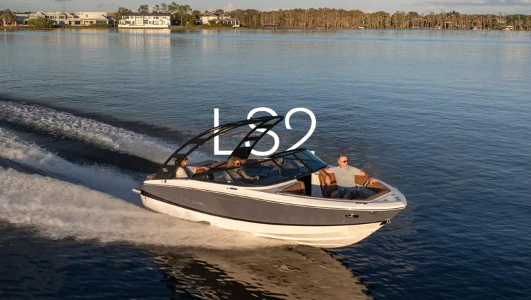 Regal LS2 bowrider gliding on a calm lake with passengers enjoying a sunny afternoon