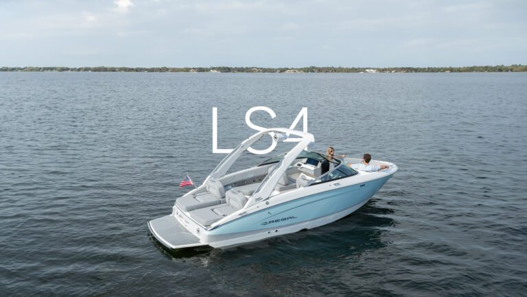 Regal LS4 bowrider anchored on open water with two passengers relaxing at the bow