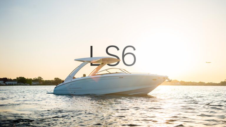 Regal LS6 sport boat floating in golden hour light with sleek lines and hardtop silhouette