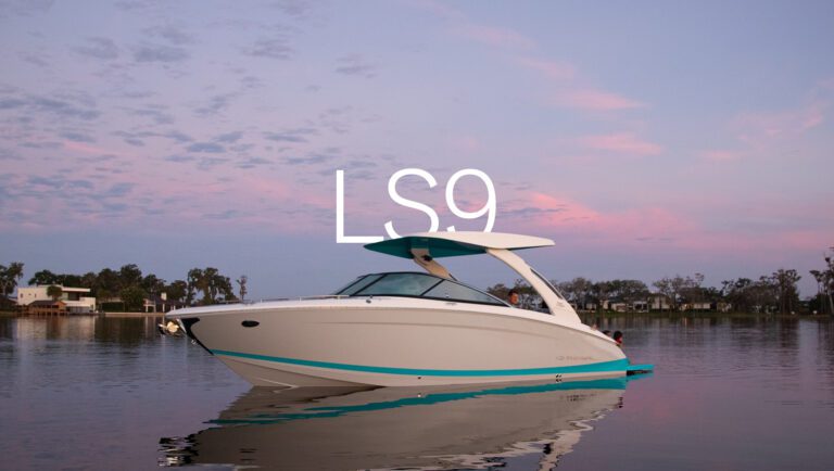 Regal LS9 bowrider at dusk with accent lighting and passengers enjoying twilight on calm waters
